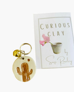 CURIOUS CLAY - Keyring